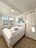 'Das gemtliche und helle Schlafzimmer mit Doppelbett'