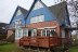 'Das Haus Olhrnweg 6 vom Garten aus gesehen. Die Holzterrasse gehrt zu \'Ihrer\' Wohnung.'