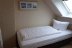 'Das Schlafzimmer mit zwei einzelnen Boxspringbetten.'