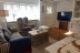 'Das gemtliche Wohnzimmer mit Couch, Sessel, TV und Kamin (nicht im Bild)'